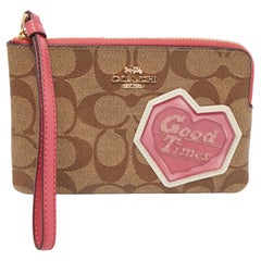 Used Coach Beige/Old Rose Signature Coated Canvas and Leather Disco Patch Wristlet Po