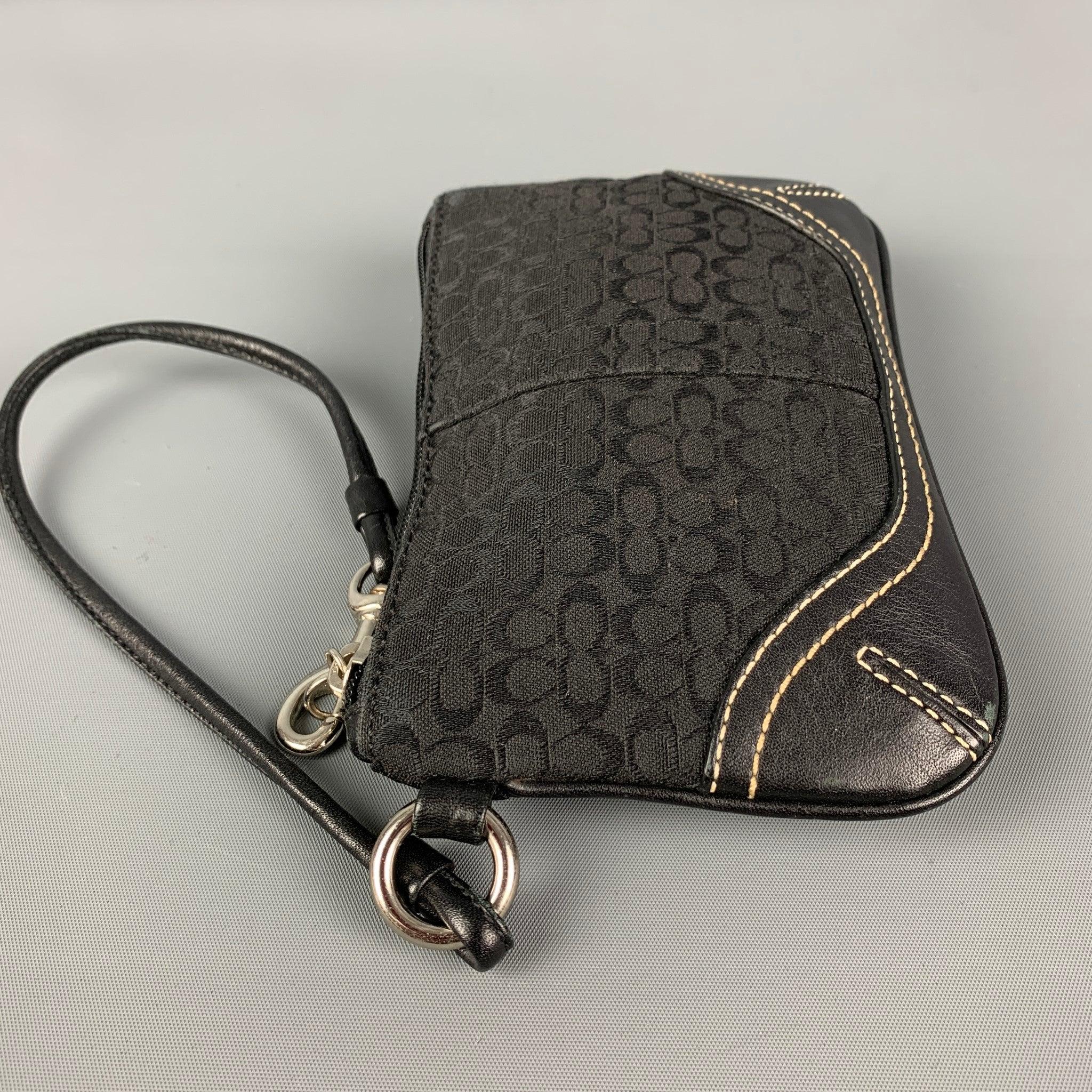 COACH wristlet comes in a black logo nylon featuring a leather trim, detachable strap, and a zipper closure.
Good
Pre-Owned Condition. 

Measurements: 
  Length: 6.25 inches  Height:
4 inches 
  
  
 
Reference: 120109
Category: Handbag & Leather