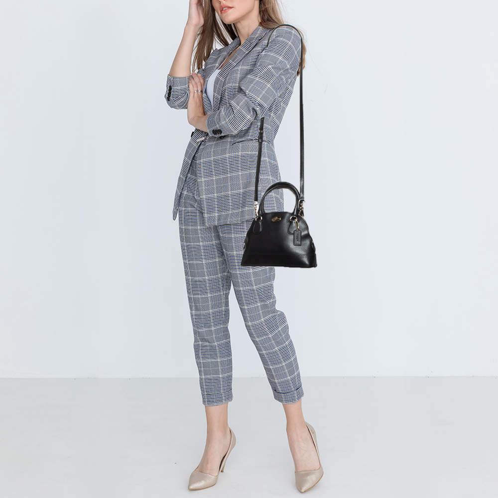 Stylish and easy to carry this designer satchel will be a fine choice for work or after. Lined well this pre loved bag for women can easily fit all your essentials. It can be held in your arm or hand.
