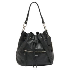 Coach Schwarze Leder-Umhängetasche mit Kordelzug Daisy