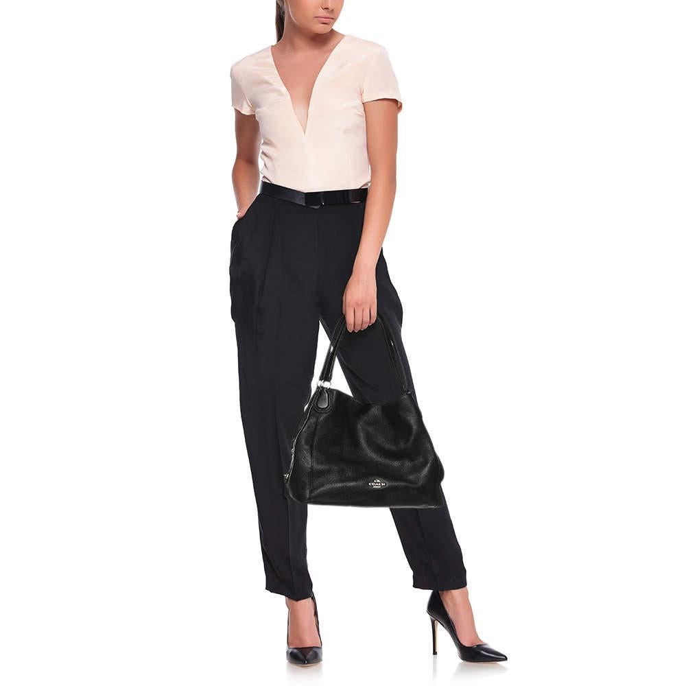 If you are looking for something that reflects chic and luxury  then this satchel is a perfect choice. Crafted from premium materials  it can be conveniently carried around and its interior is spaciously sized to house your belongings with ease.