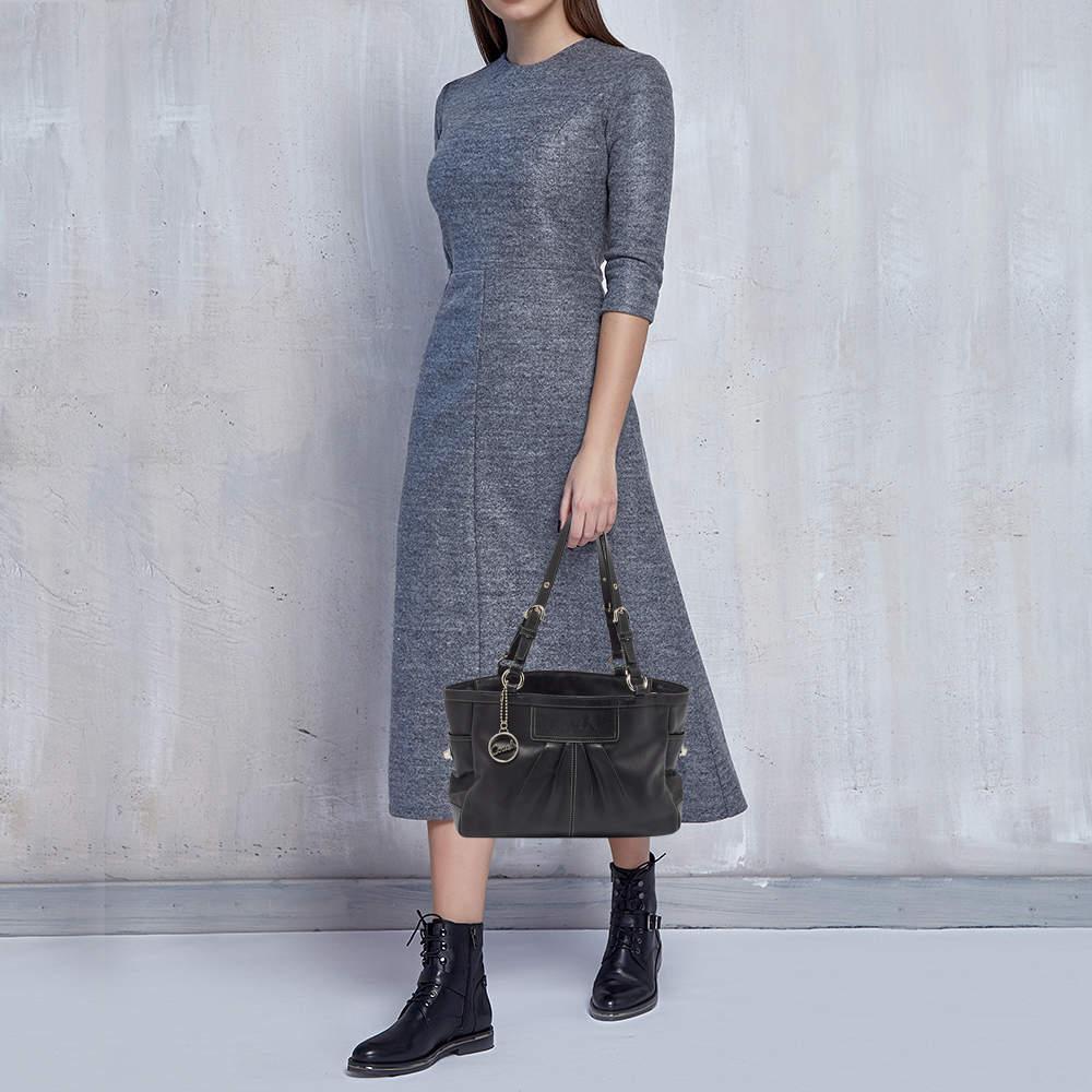 This alluring tote bag for women has been designed to assist you on any day. Convenient to carry and fashionably designed  the tote is cut with skill and sewn into a great shape. It is well equipped to be a reliable accessory.