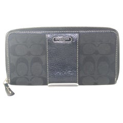 Portefeuille monogramme noir de Coach 1C82K