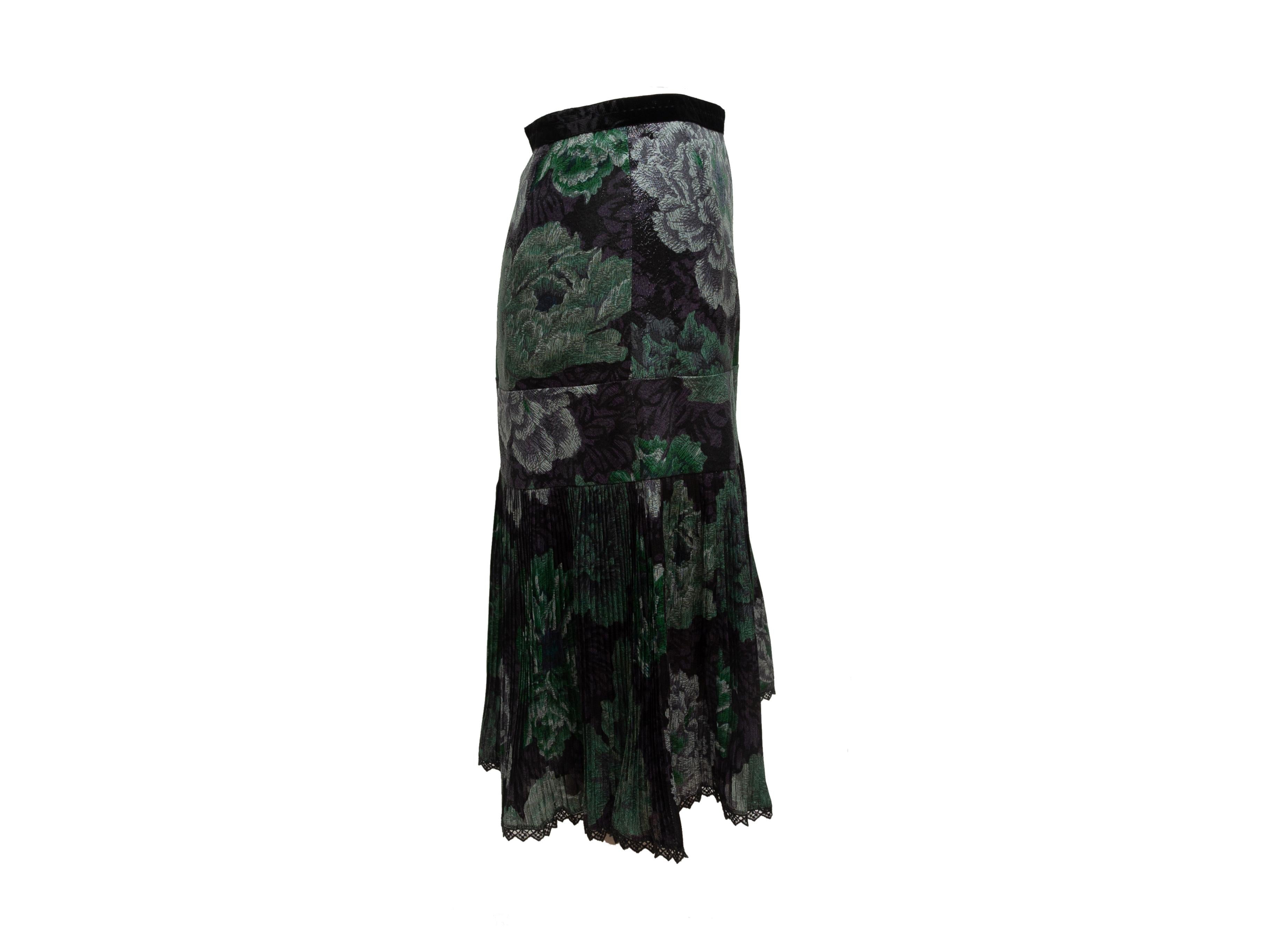 Product details: Black, green and eggplant silk skirt by Coach. Floral print throughout. 28