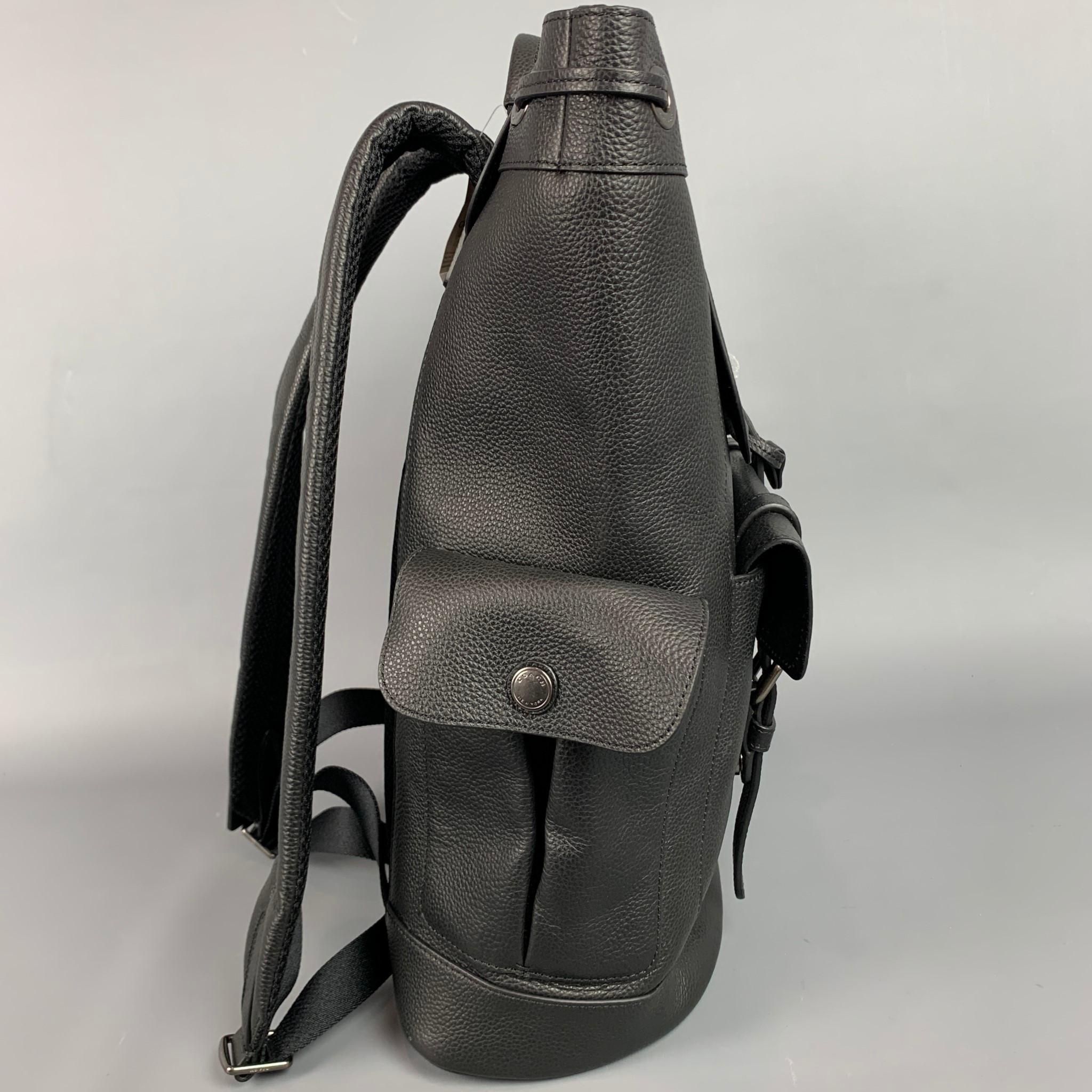 COACH backpack comes in a black pebble grain leather featuring adjustable shoulder straps, inside zipper pocket, outside flap pockets, drawstring, top handle, and buckle closures.

New With Tags.
Marked: F36811
Original Retail Price: