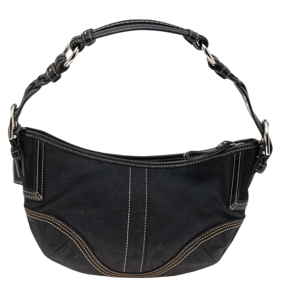 Crafted from black signature canvas and leather, this Coach hobo has a style that will catch glances from a mile. It has been designed with contrasting stitches. It opens to a fabric interior and is held by a single handle. Durable and stylish, this