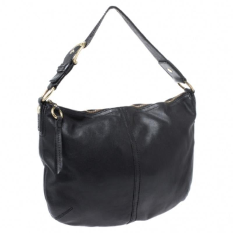 Add a stylish touch to your look with this black Coach hobo. Crafted from soft leather, this hobo is held by a single handle and comes with a satin interior that is scured by a zip closure. Carry all your essentials in this fashionable bag.