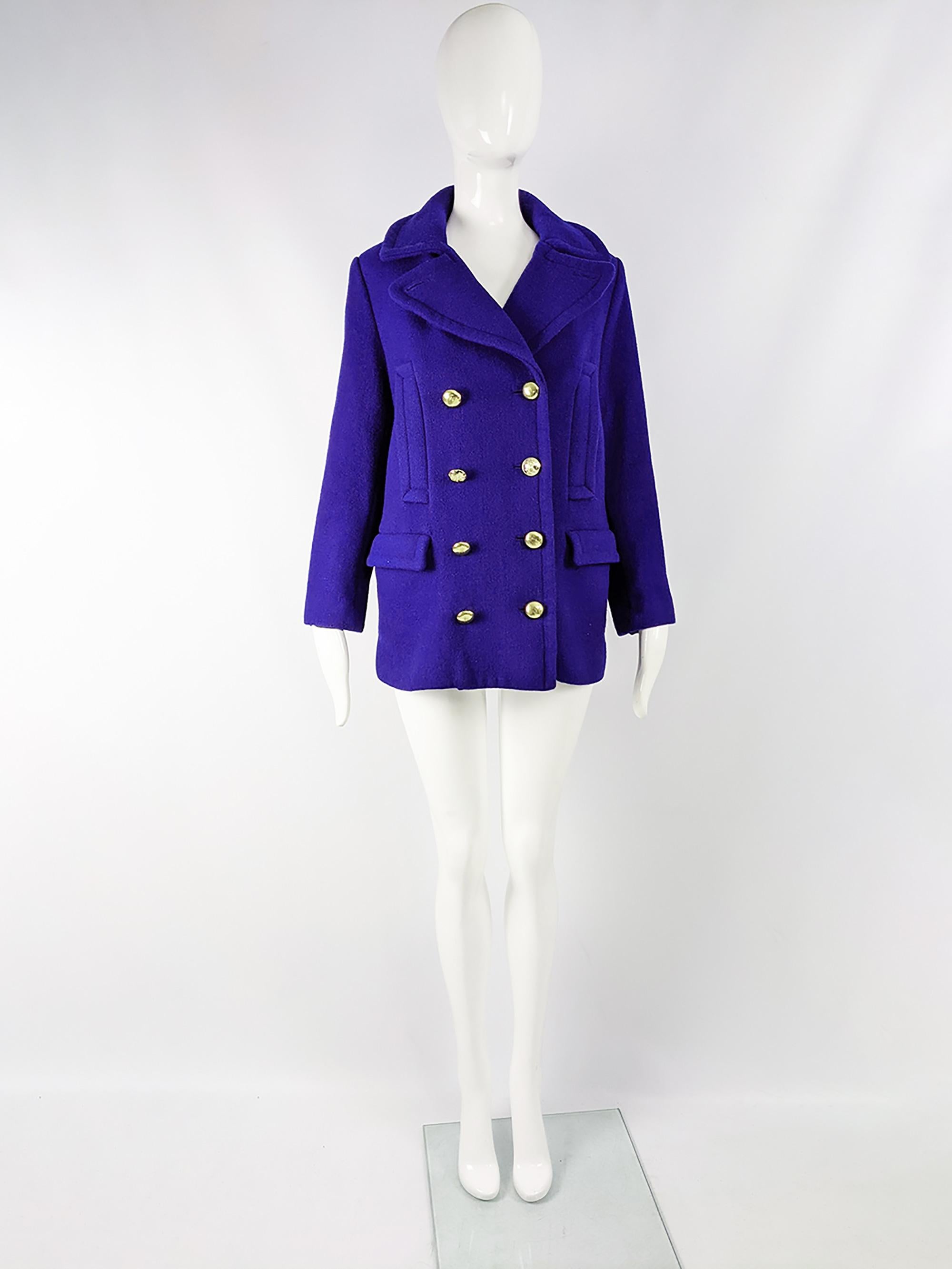A glamorous Coach pea coat in a blue wool blend with branded military style gold double breasted buttons. 

Size: Marked Small / Petite. 
Bust - 36” / 91cm (allow roughly 2-4