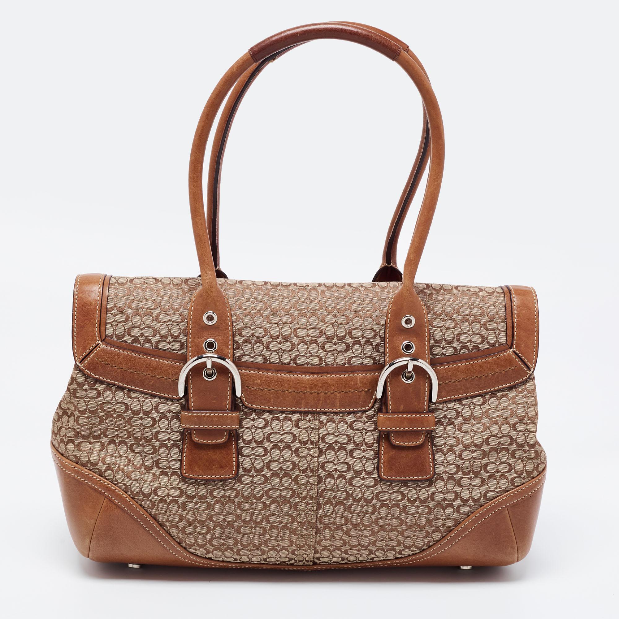 If you are seeking something that reflects chic and luxury, then this Coach satchel is a perfect choice. Crafted from signature canvas and leather, it displays a buckle closure on the front flap, silver-tone hardware, and dual handles. The