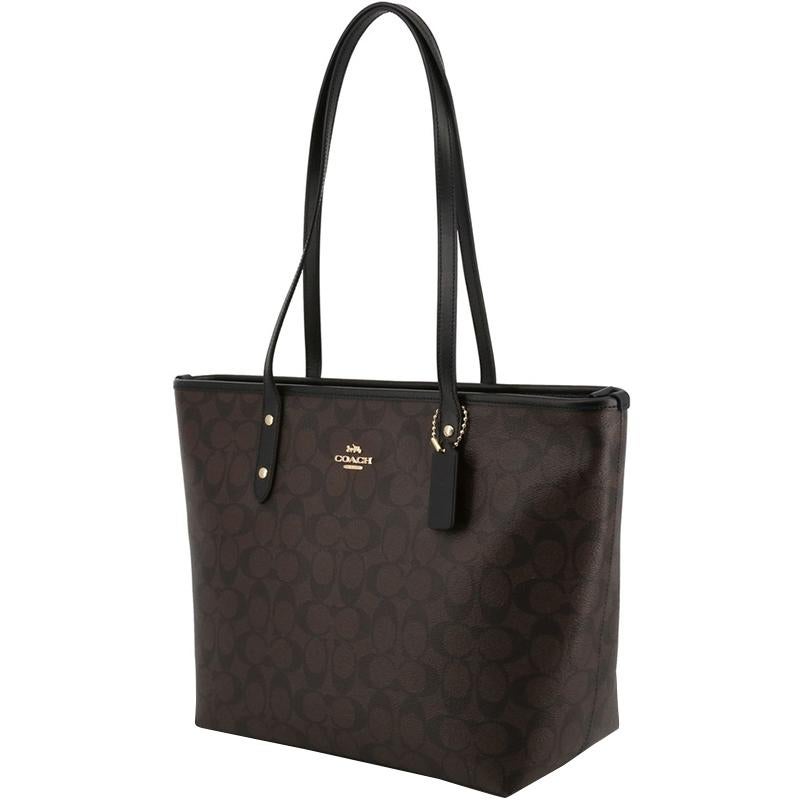 This Coach City Zip tote has been expertly designed from a brown and black signature coated canvas body and secured with top zipper closure. It comes fitted with two flat top handles and detailed with gold-tone brand lettering on the exterior. It