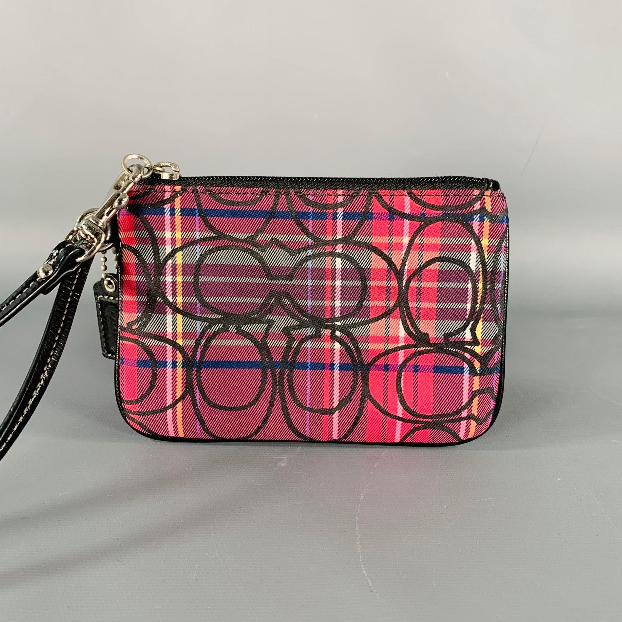 COACH wallet
in a
burgundy canvas featuring a plaid pattern with CC monogram, wristlet style with black patent leather strap, and zip closure. Excellent Pre-Owned Condition.5.5 x 4 inches 
  
  
 
Sui Generis Reference: 134410
Category: Handbag &