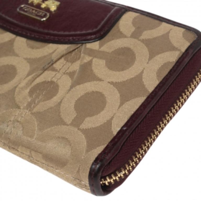 Coach Burgundy/Brown Op Art Fabric and Leather Madison Continental Wallet In Fair Condition For Sale In Dubai, Al Qouz 2