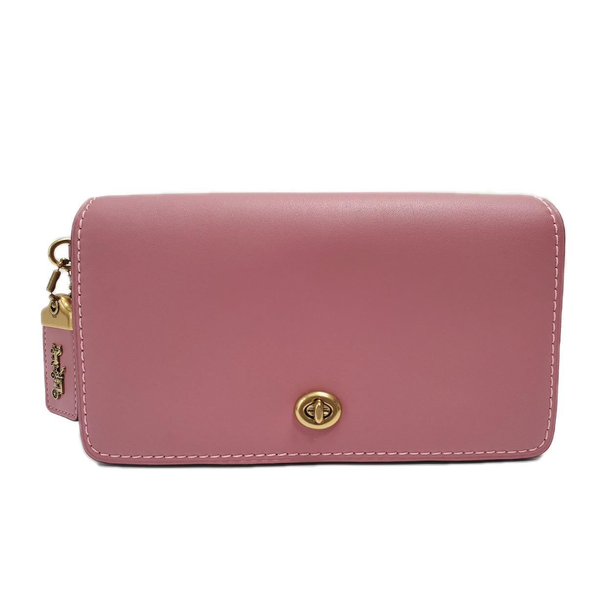 Brand - Coach
Collection - Dinky
Estimated Retail - $295.00
Style - Crossbody
Material - Leather
Color - Pink
Closure - Turn Lock
Hardware Material - Goldtone
Size - Small
Feature - Detachable Strap
Product Line - Coach Dinky
Bag Depth - 2 in
Bag