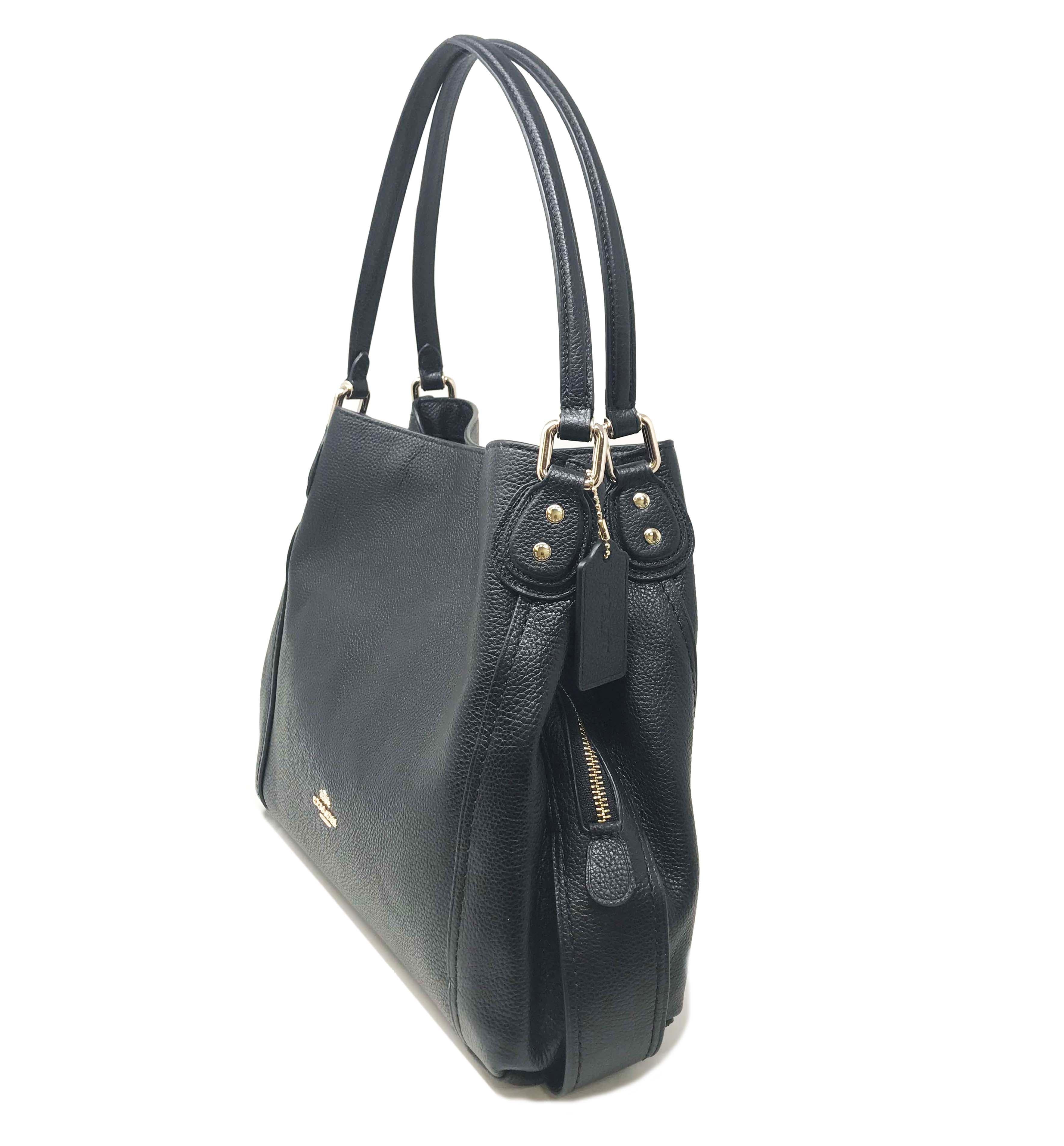 Coach
Color/Material: Black Leather
Exterior Design Details: Gold-Tone Hardware, Turnlock Zipper Latch
Interior Design Details: Fabric Interior, Dual Compartments, Zippered Center Compartment, Slide Pockets, Zippered Pocket
Top Handles Drop 8in
Open