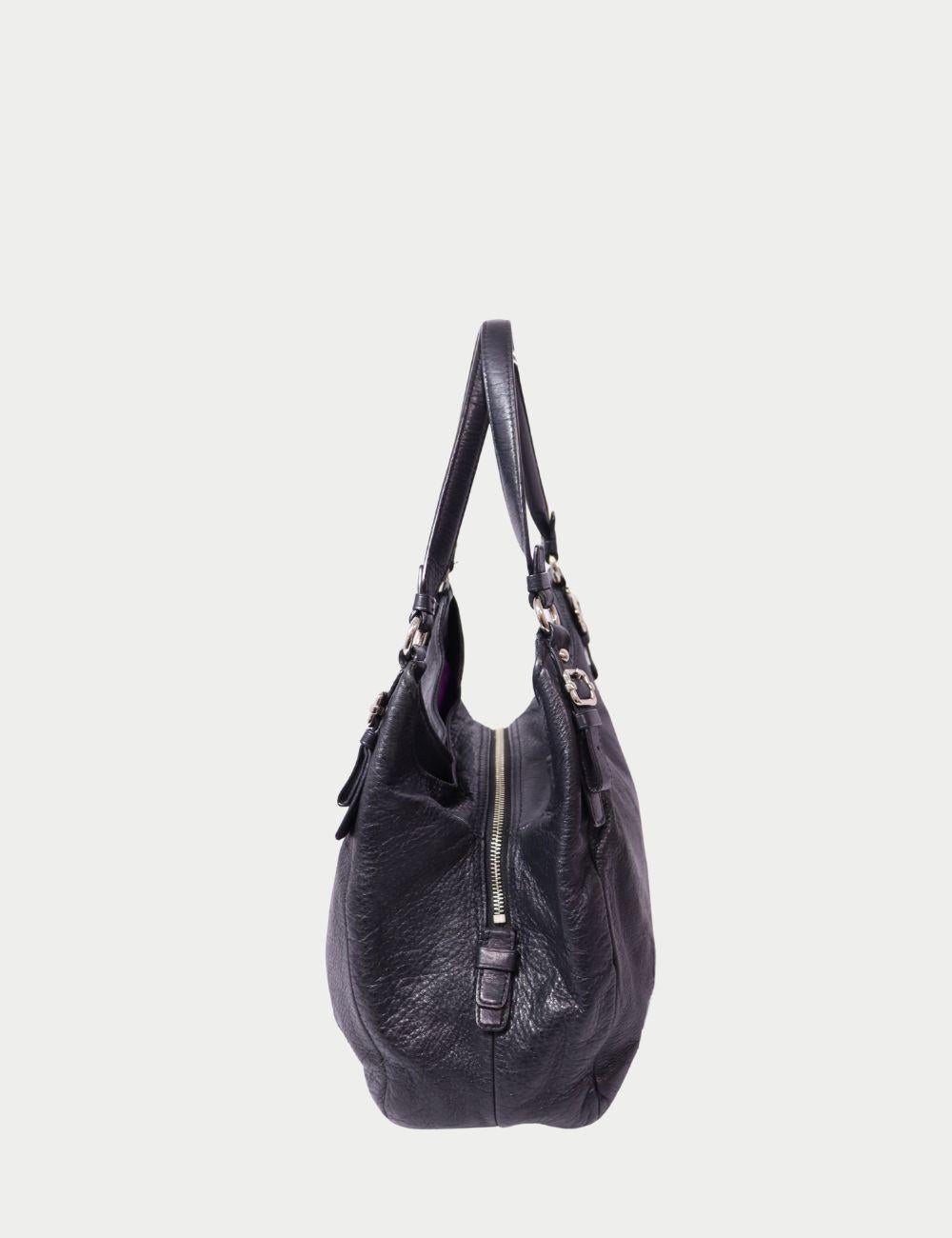 Coach Black Leather Shoulder Bag with Silver Hardware

Classic, functional, and effortlessly chic—this Coach black leather shoulder bag is crafted from supple pebbled leather and finished with the brand’s iconic horse and carriage logo in