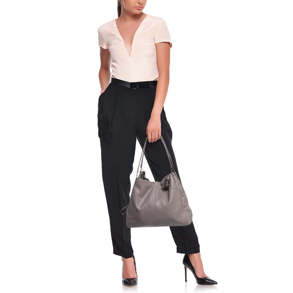 Get style and carry your essentials with ease using this designer shoulder bag. It has been crafted using high-quality materials to be a standout accessory.