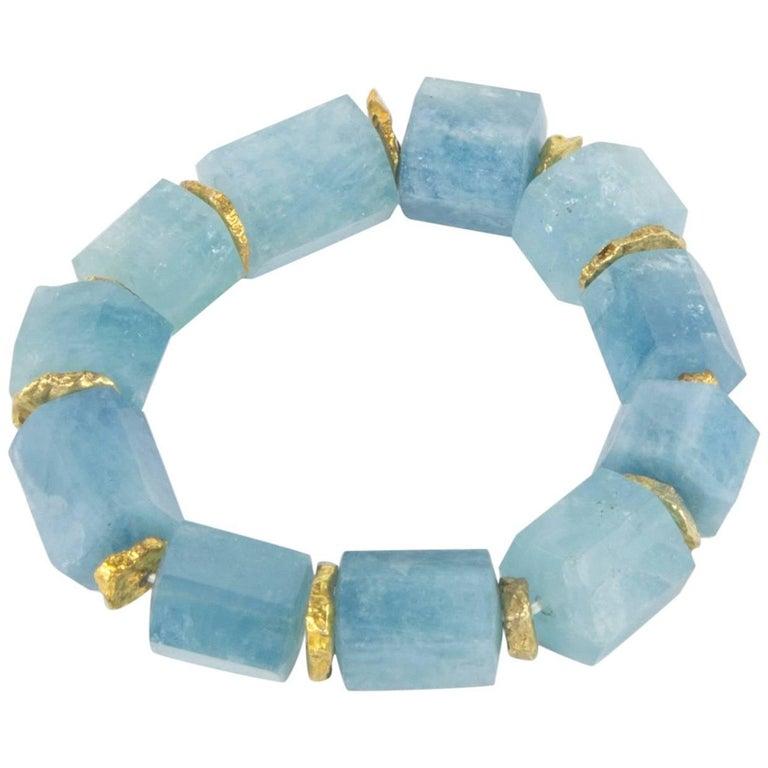 Beautiful in its simplicity…Natural Aquamarine beads Bracelet, inter-spaced with Gold plated Sterling Silver spacers; expandable to fit small-average and plus wrists. Chic and Timeless...Illuminating your Look with a touch of class! 
