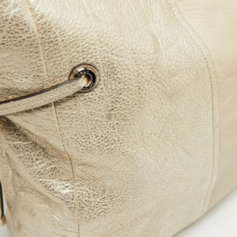 Bolso bandolera Coach de cuero dorado claro con cordón lateral Oro en venta