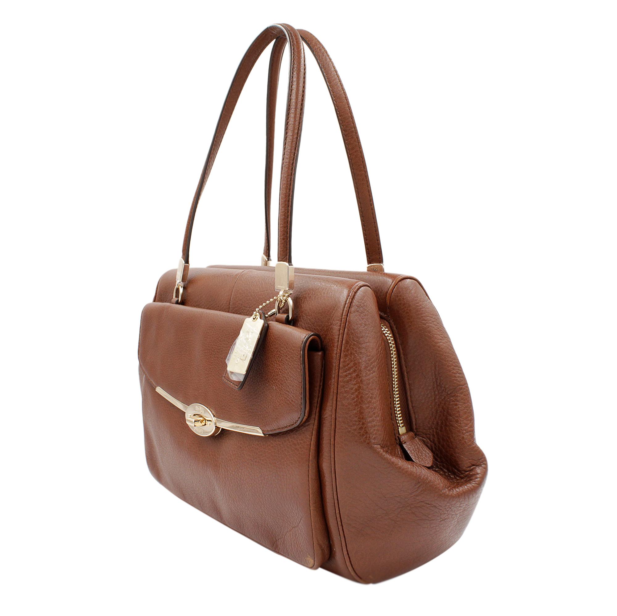 This Coach Madison Madeline 25166 Brown Leather Ladies Satchel is new with defects. It comes with no papers. It has additional 13.5 Inch long strap for cross body and shoulder wear, zip pocket, cell phone pocket and multifunction pockets inside, a