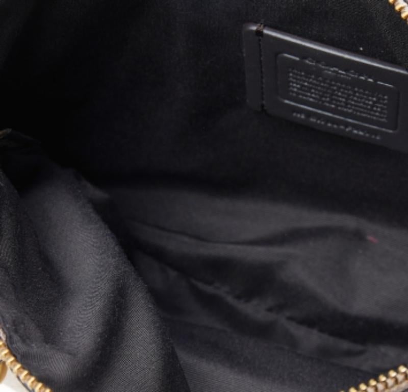 Coach's tote is chic and smart. Crafted from leather, it features two handles and a shoulder strap. The zip fastening on the top opens to a fabric-lined interior that has enough space for all your daily essentials.