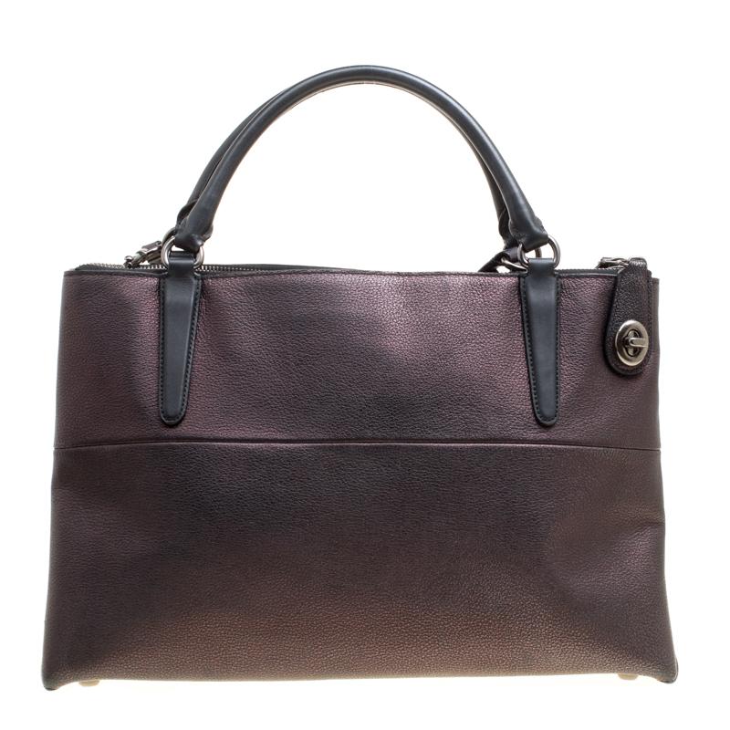 This gorgeous bag from Coach will give you days of style and ease. It is crafted from leather and made in a simple design. It is equipped with a spacious fabric interior, two handles and a shoulder strap.

Includes: Packaging
