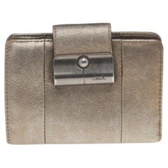 Coach Portefeuille compact en cuir doré métallisé