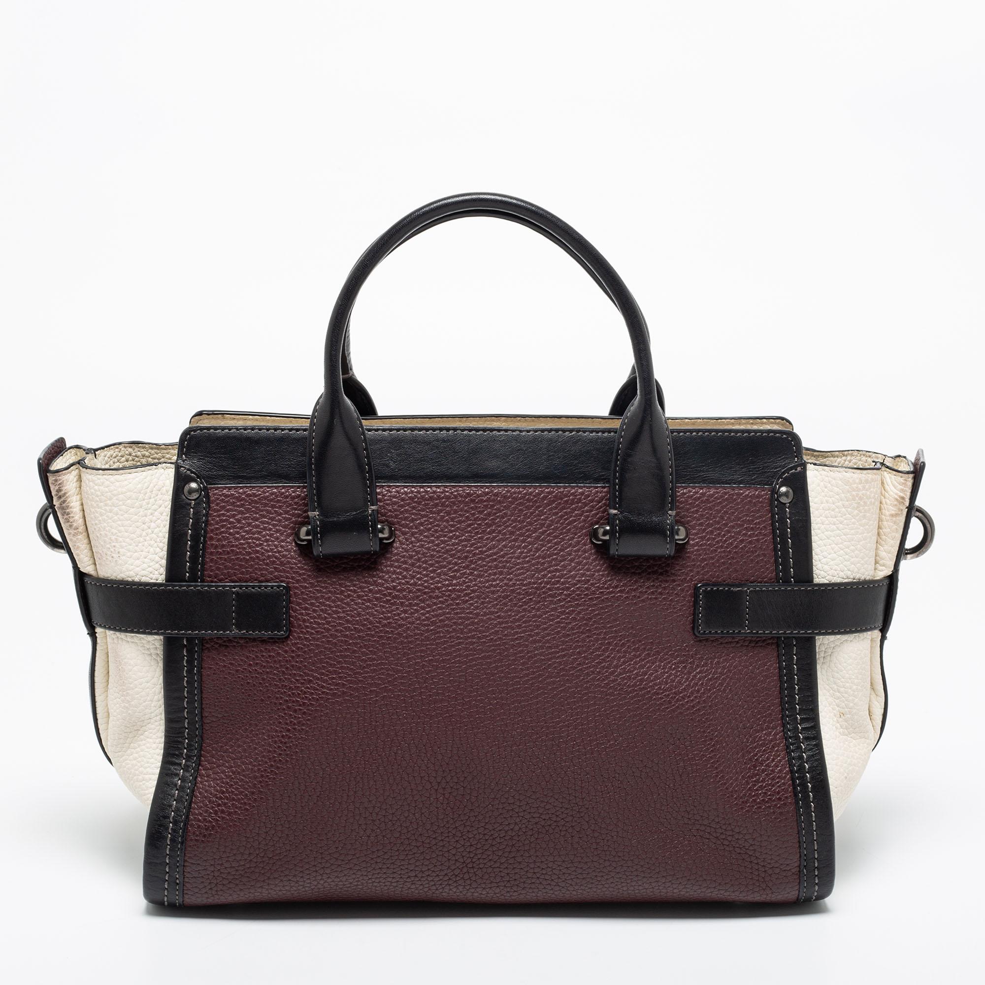 Meticulously crafted from leather, this Coach Swagger tote is functional yet stylish. It carries a multicolored exterior and a top zipper that opens into a spacious interior designed to carry your essentials. The bag is equipped with two handles and