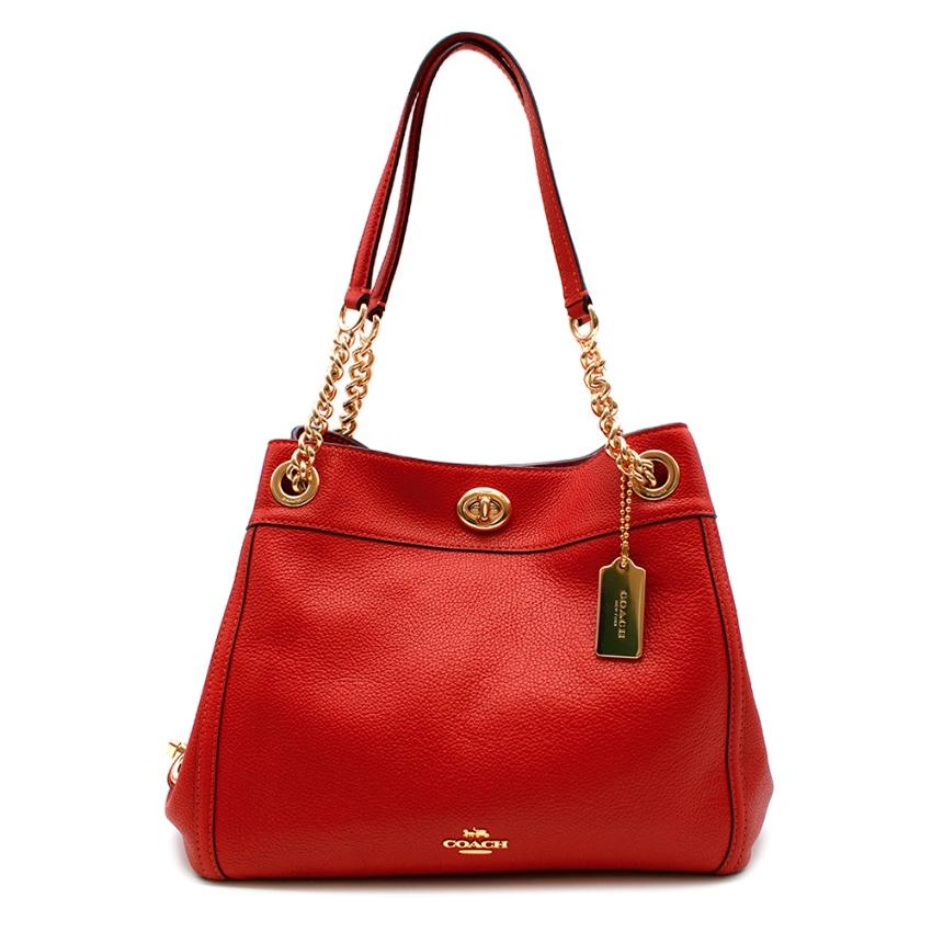 Coach New Season Red Turnlock Edie Shoulder Bag with Golden Hardware 

-Gorgeous sturdy grained leather 
-Elegant timeless style 
-Rich warm red hue 
-Coach golden logo metal tag 
-Branded golden hardware 
-Twist fastening to the top 
-Interior
