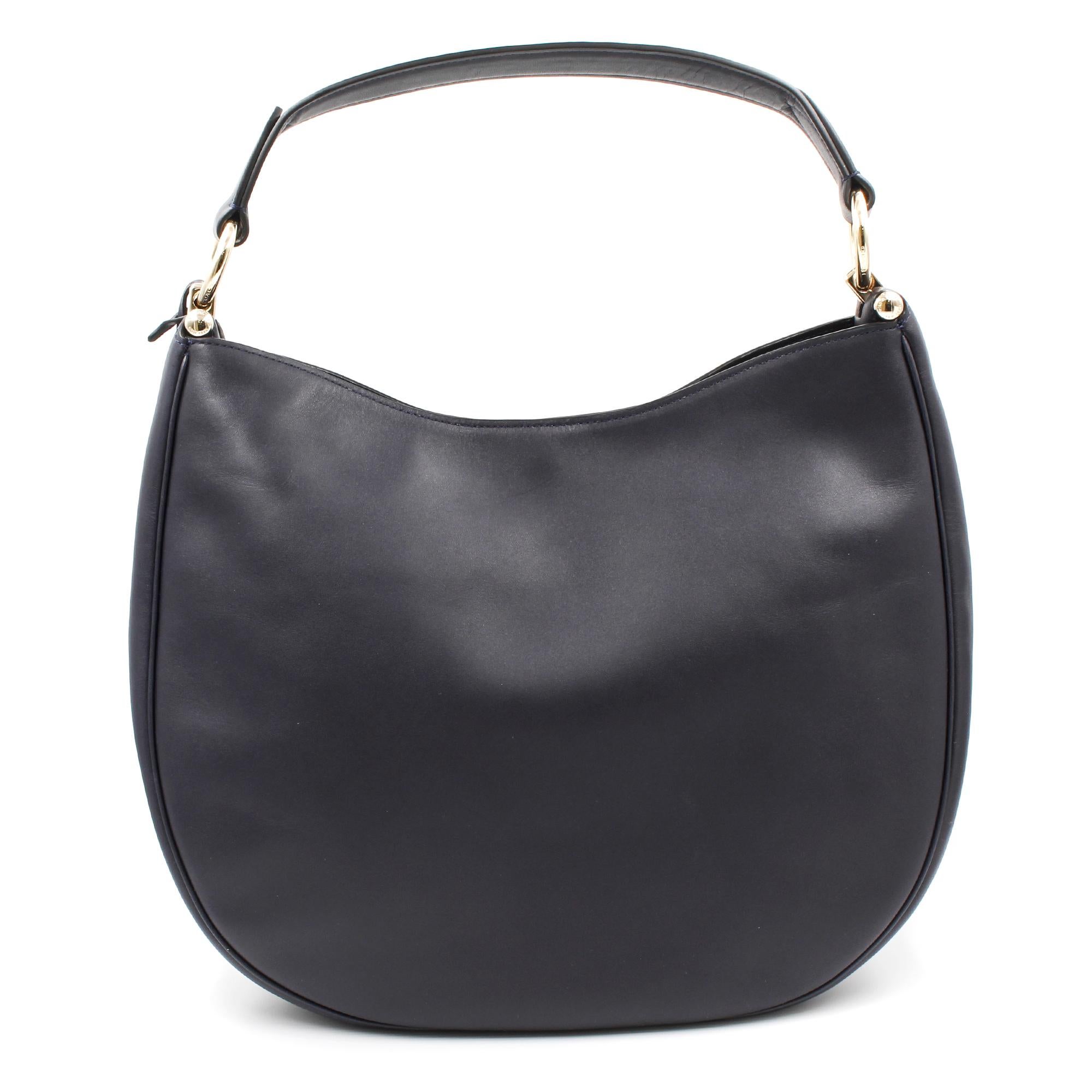 Soft and slouchy in supple glove-tanned leather, this simple, graceful silhouette is dressed up with striking hardware, including a Gold Tone metal bag charm. Featuring multiple wear straps to polish off any look.
Made of leather.
Magnetic snap