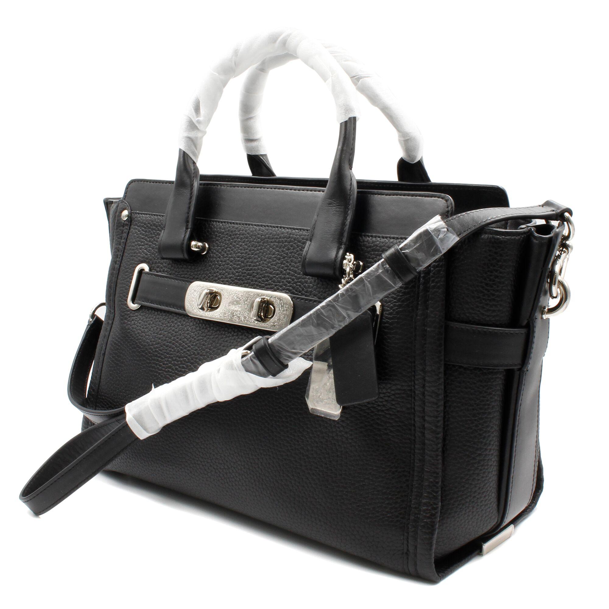 Coach Pebble Leather Swagger Bag Satchel Black Silver Hardware Medium Ladies Handbag.
Pebble leather
Inside zip, cell phone and multi-function pockets
Zip-top closure, fabric lining
Handles with 4 1/2