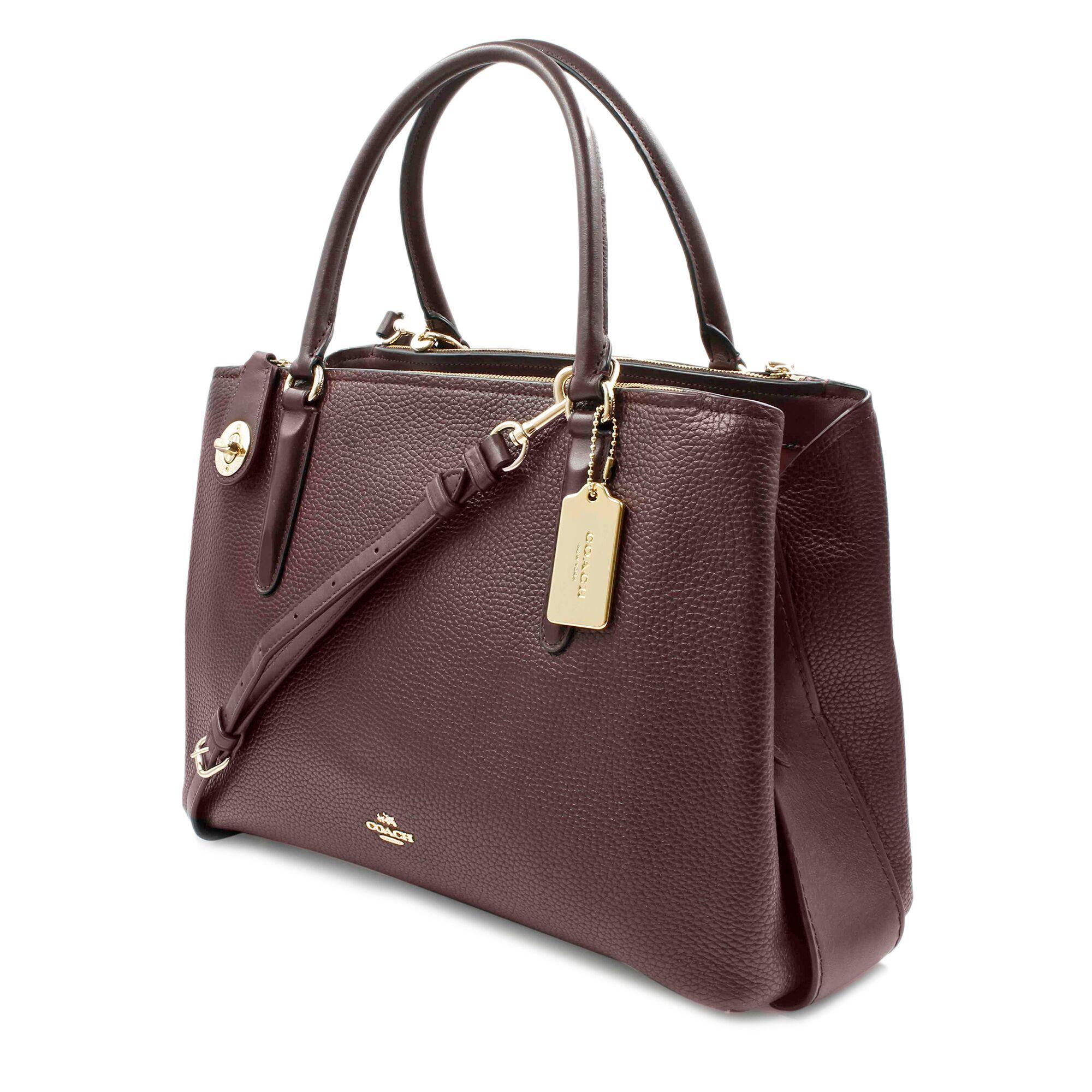 Coach Pebbled Brooklyn 28 Carryall. Pebble leather. Inside zip and multifunction pockets. Zip-top closure, leather lining. Handles with 5 inch