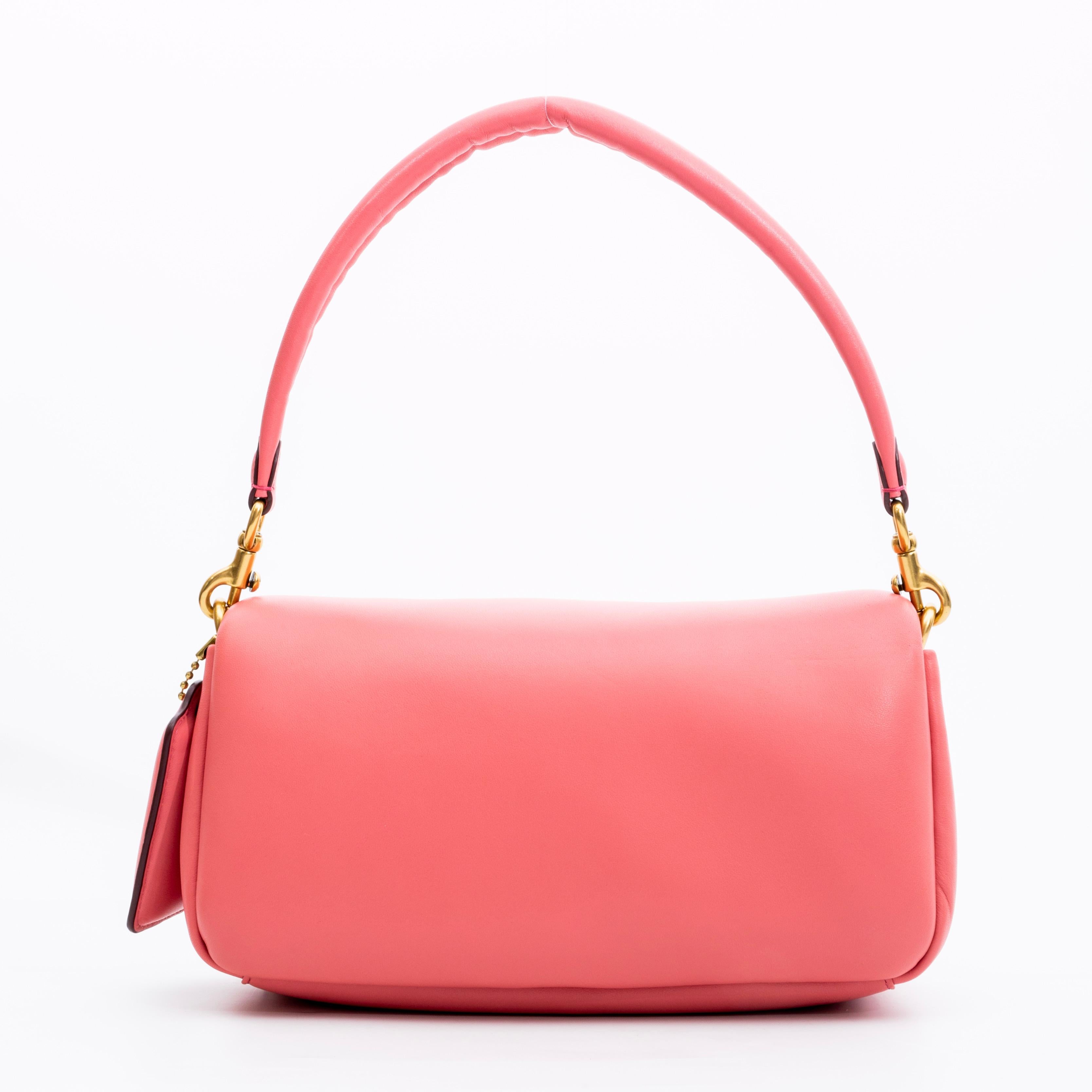 This bag is made with nappa leather and smooth leather and features pillowy padding, snap closure on flap, removable/adjustable crossbody strap, dual interior compartments and can be worn shoulder or cross body.

COLOR: Pink
MATERIAL: Leather
ITEM