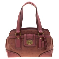 Coach: borsa tascabile in pelle rosa con chiusura a scatto