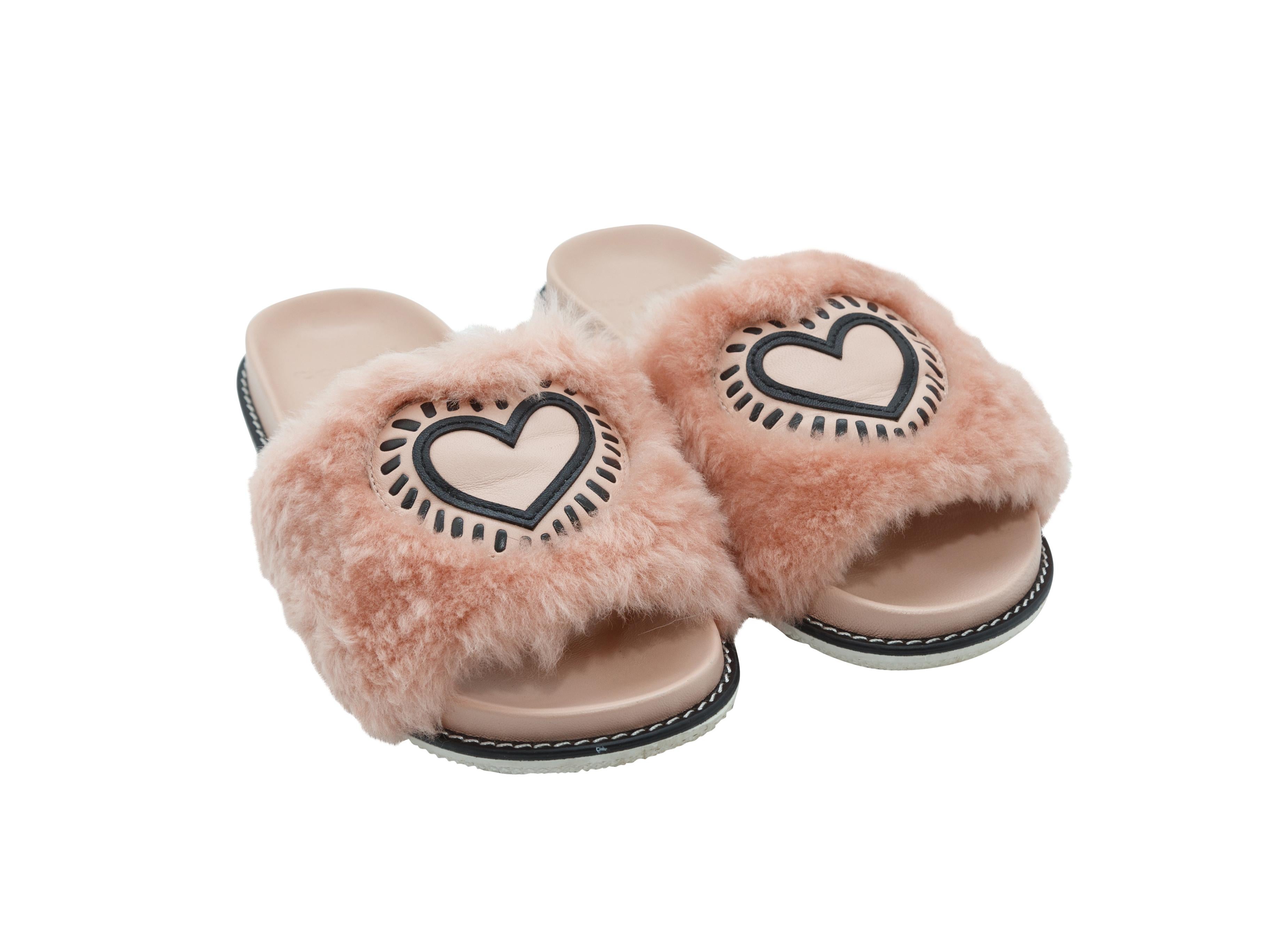 Product details: Pink fur slides by Coach x Keith Haring. Slip-on style. Heart detailing at tops.
Condition: Pre-owned. Good. Some signs of wear at soles. Includes box.
Est. Retail $ 195.00