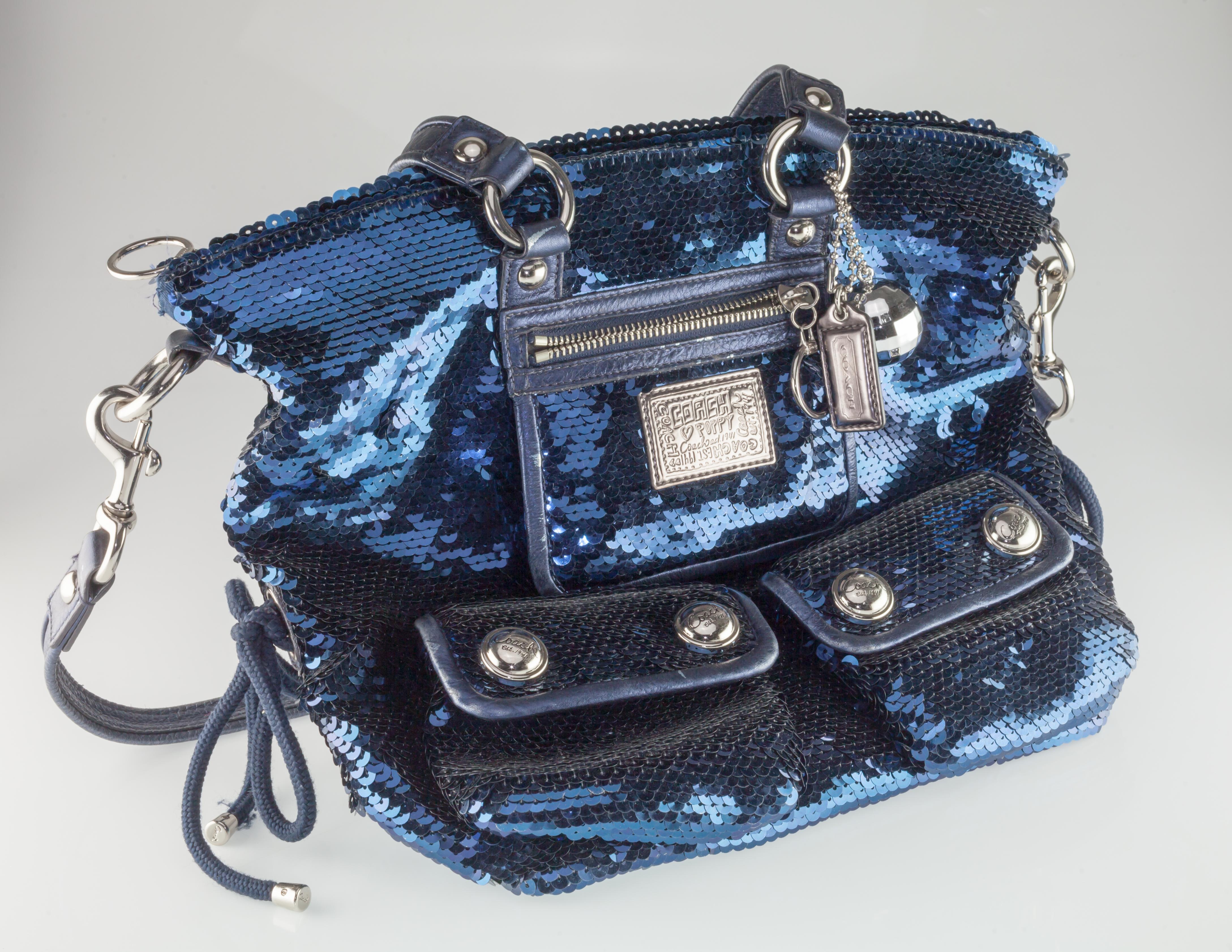 Coach Poppy Blue Sequin Spotlight Purse w/ Disco Ball Bag Charm XL

Gorgeous Sequin Poppy Purse by Coach
Features a Number of Silver Elements, a Tag Zipper, and a Disco Ball Bag Charm
12