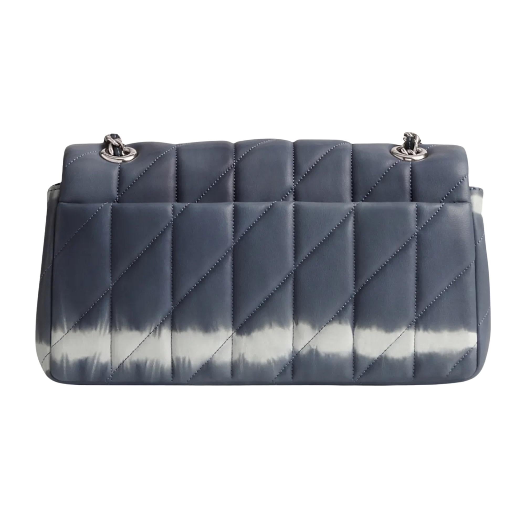 Color: Blue tie-dye
Material: Napa leather
11001762JAX
Comes with: Dust bag
Condition: Excellent.

Measurements~
Height 5.5”
Width 10.3”
Depth 3.3”
Drop: 21.5”