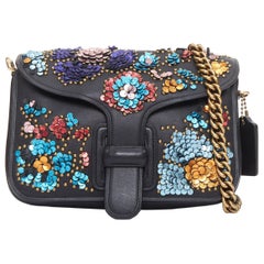 COACH Rodarte Courier, borsa a tracolla con catena in pelle con applicazioni floreali multicolore
