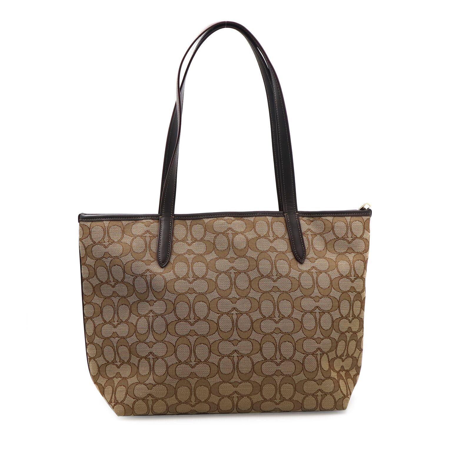 Coach Signature Taylor Women's Brown Tote 37229 LIC7C
This tote is crafted in signature fabric, with ample room for essentials inside. gold-tone hardware create the quintessential Coach finish to its hand-assembled design. Signature jacquard