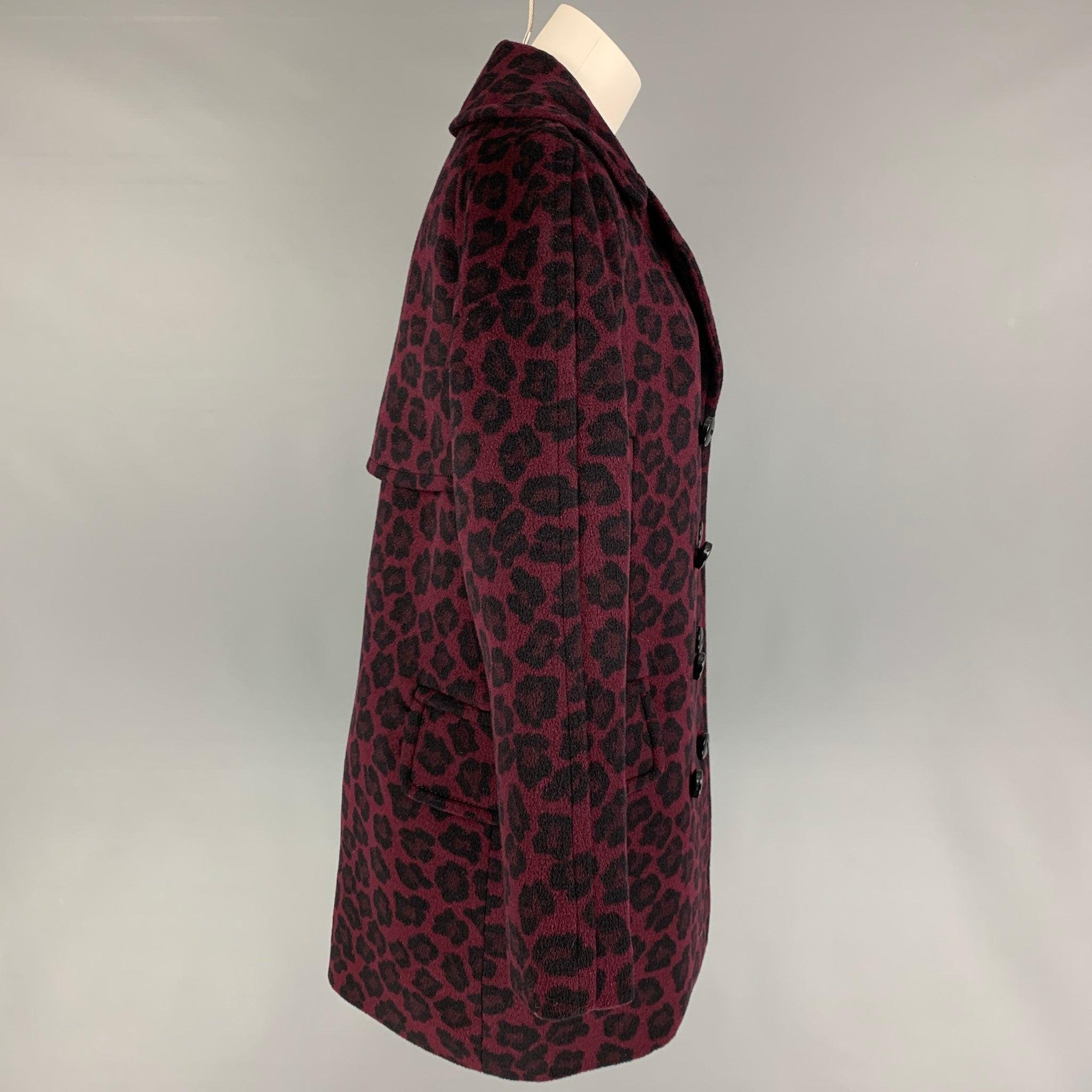 COACH coat comes in a burgundy & black animal print wool with a full liner featuring a notch lapel, flap pockets, and a double breasted closure.
Very Good
Pre-Owned Condition. 

Marked:   M  

Measurements: 
 
Shoulder: 17.5 inches  Bust: 40 inches 