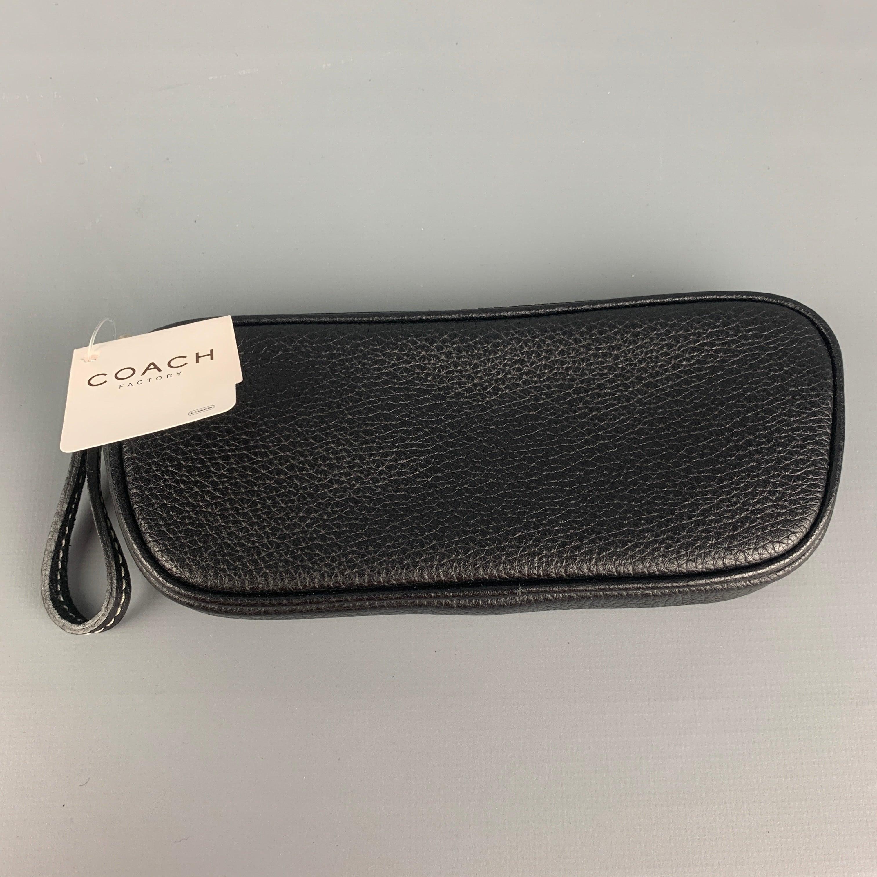 COACH coin purse comes in a black textured leather featuring a zipper closure.
New With Tags.
 

Measurements: 
  Length: 6.5 inches  Width: 0.75 inches  Height: 3 inches  
  
  
 
Reference: 94724
Category: Bags & Leather Goods
More Details
   