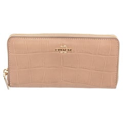 Coach tan crocodile embossed leather zippy wallet with gold-tone hardware, logo