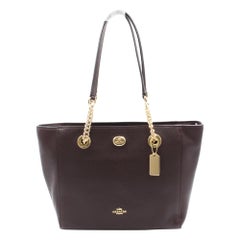 Coach Turnlock Oxblood Ladies Medium Leather Tote Handbag 57107