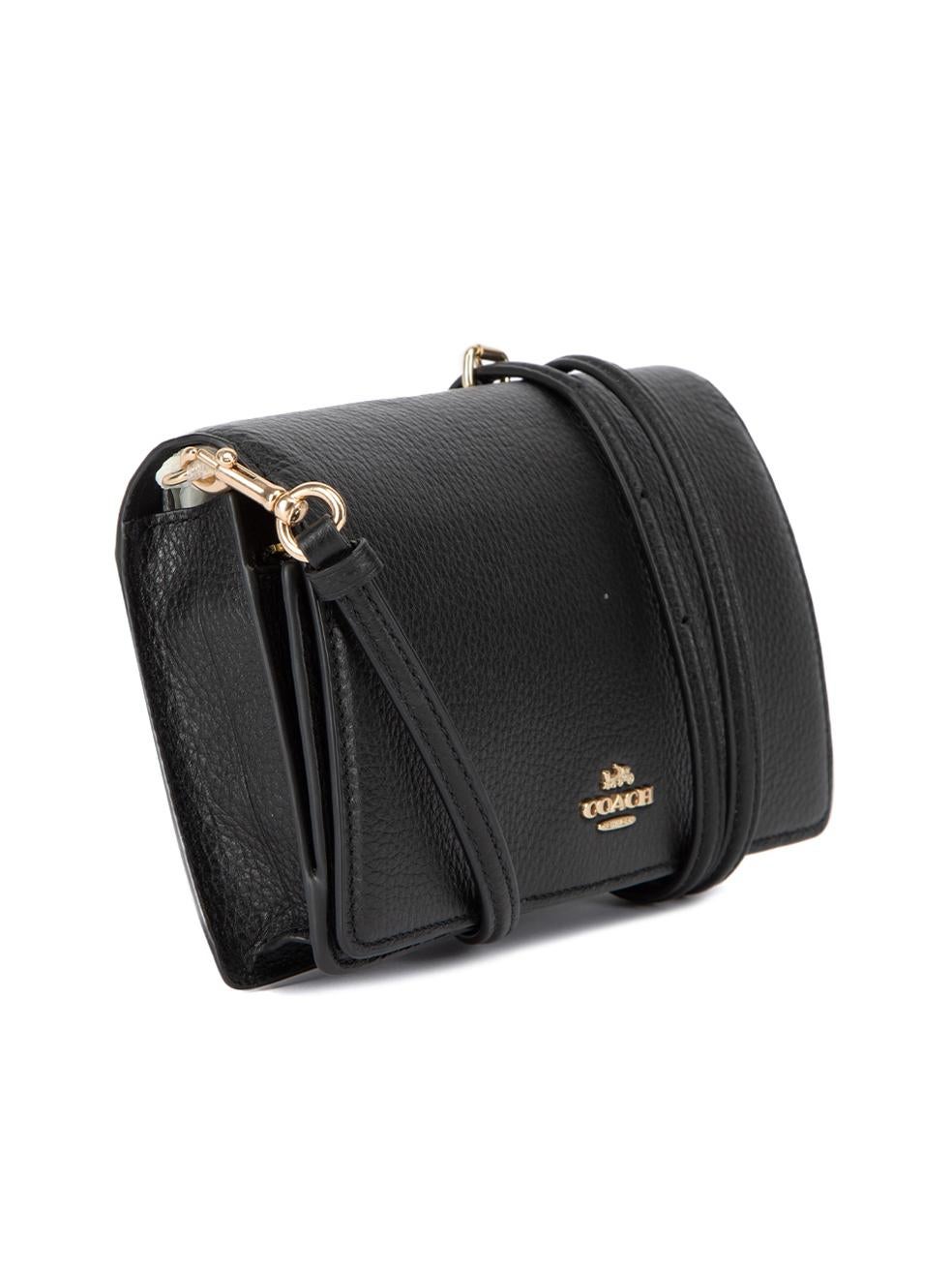 CONDITION is Never Worn. No visible wear to bag is evident on this used Coach designer resale item. Details Black Leather Crossbody clutch 1x Detachable and adjustable shoulder strap Front flap snap button closure Two main compartment 1x Zipped