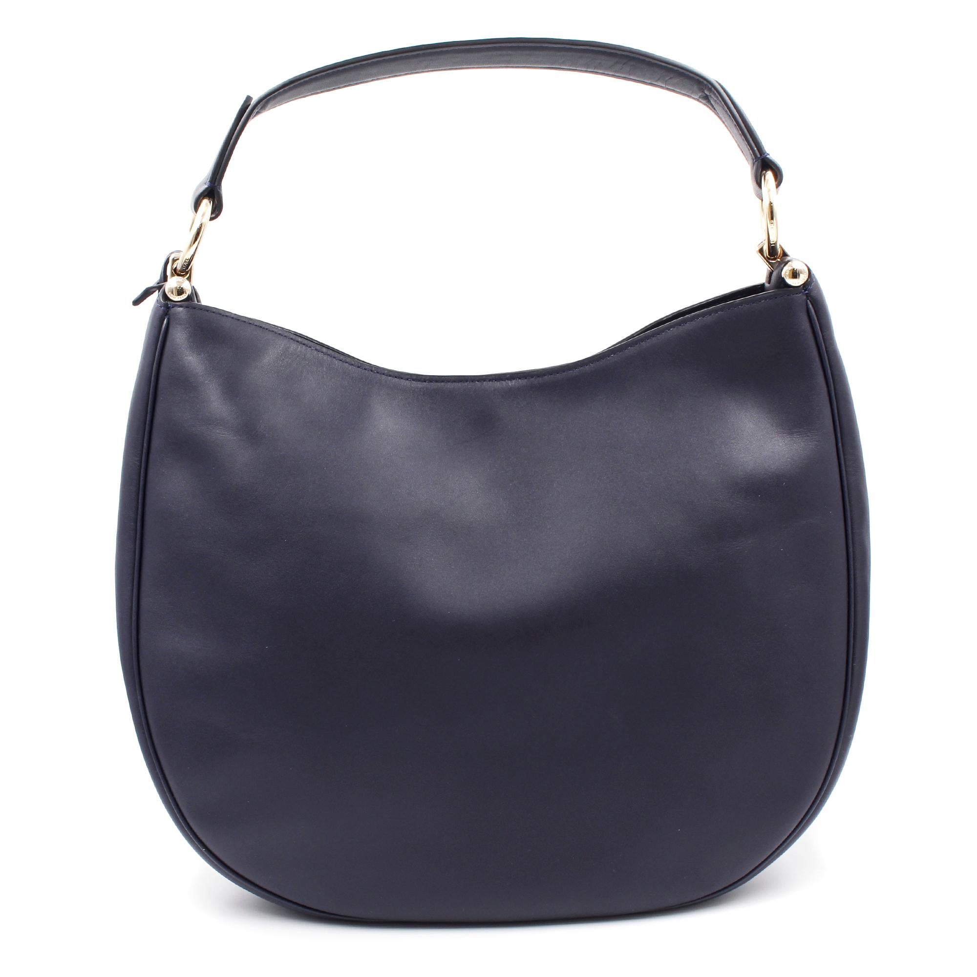 Soft and slouchy in supple glove-tanned leather, this simple, graceful silhouette is dressed up with striking hardware, including a polished metal bag charm. Featuring multiple wear straps to polish off any look.
Made of leather.
Magnetic snap