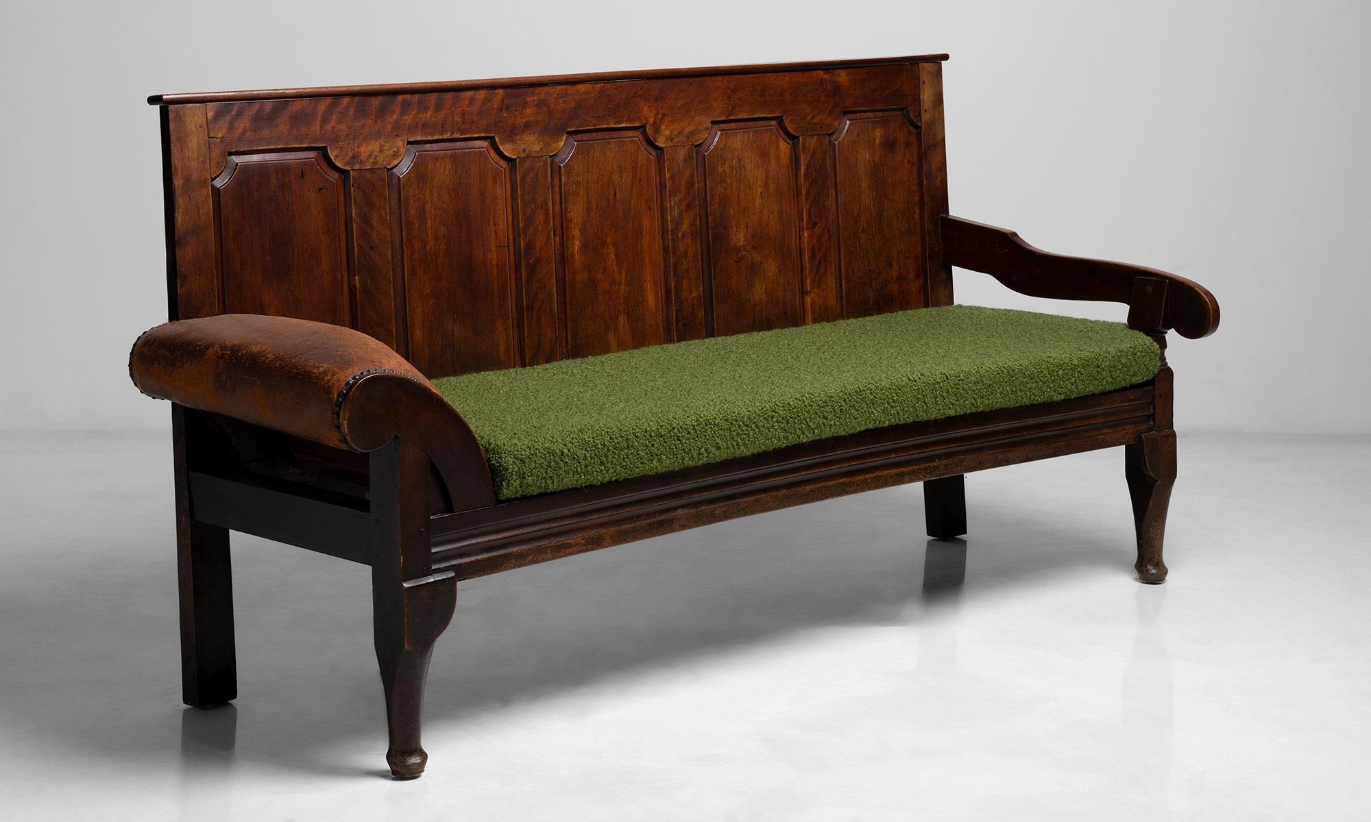 Coachman’s Settle

England circa 1790

Unique bench constructed in solid fruit wood with paneled back and leather upholstered roll over arm. 

Designed for the coachman to rest his head. Seat cushion newly upholstered in boucle by Pierre
