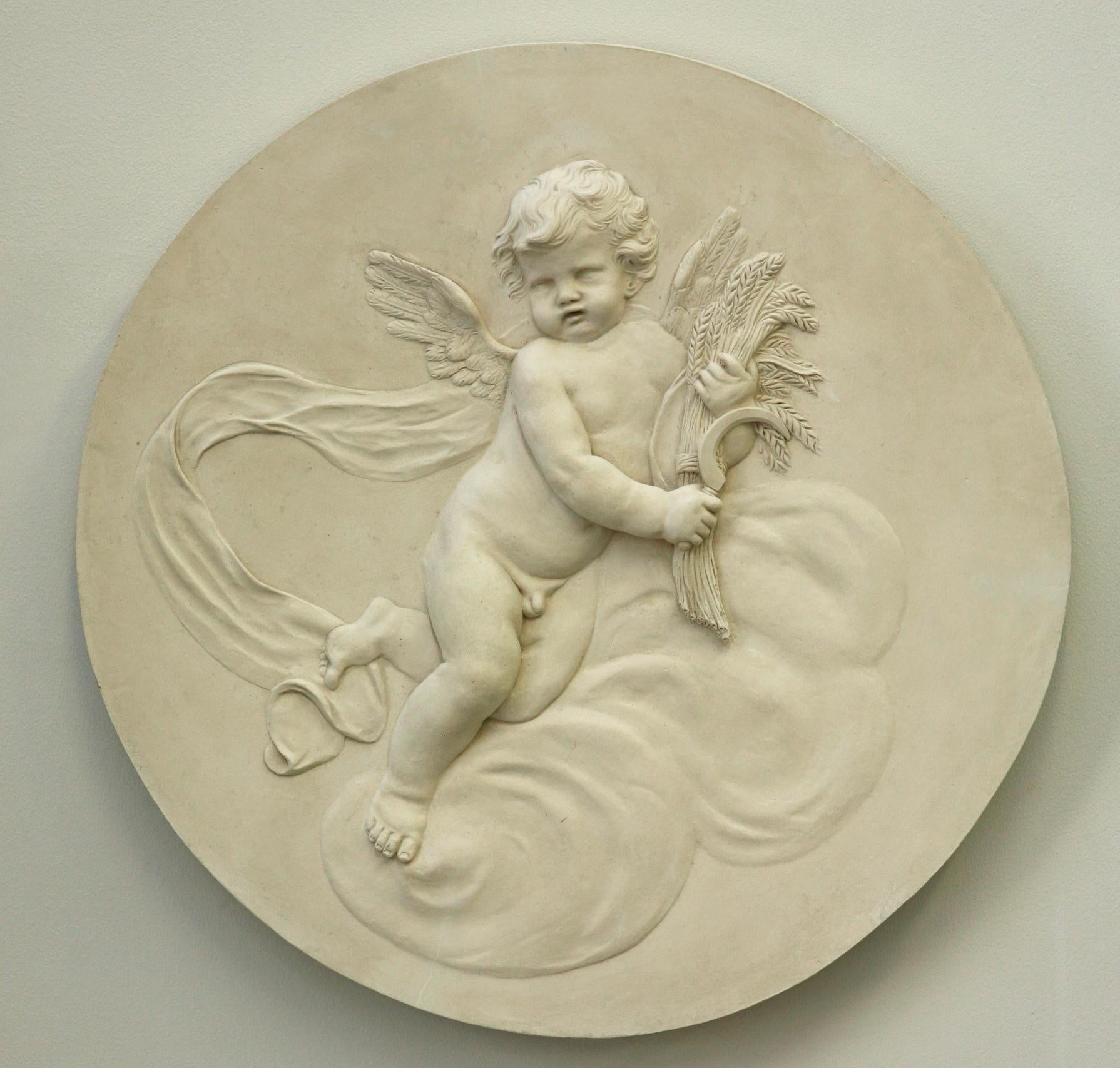 Coade Studio decorative roundel depicting 'Summer' cherub floating on cloud formation. 'Summer' is holding wheat. Modelled in delicate low relief. The four seasons roundels are influenced by the 18th century Coade designs.

Also available as a set