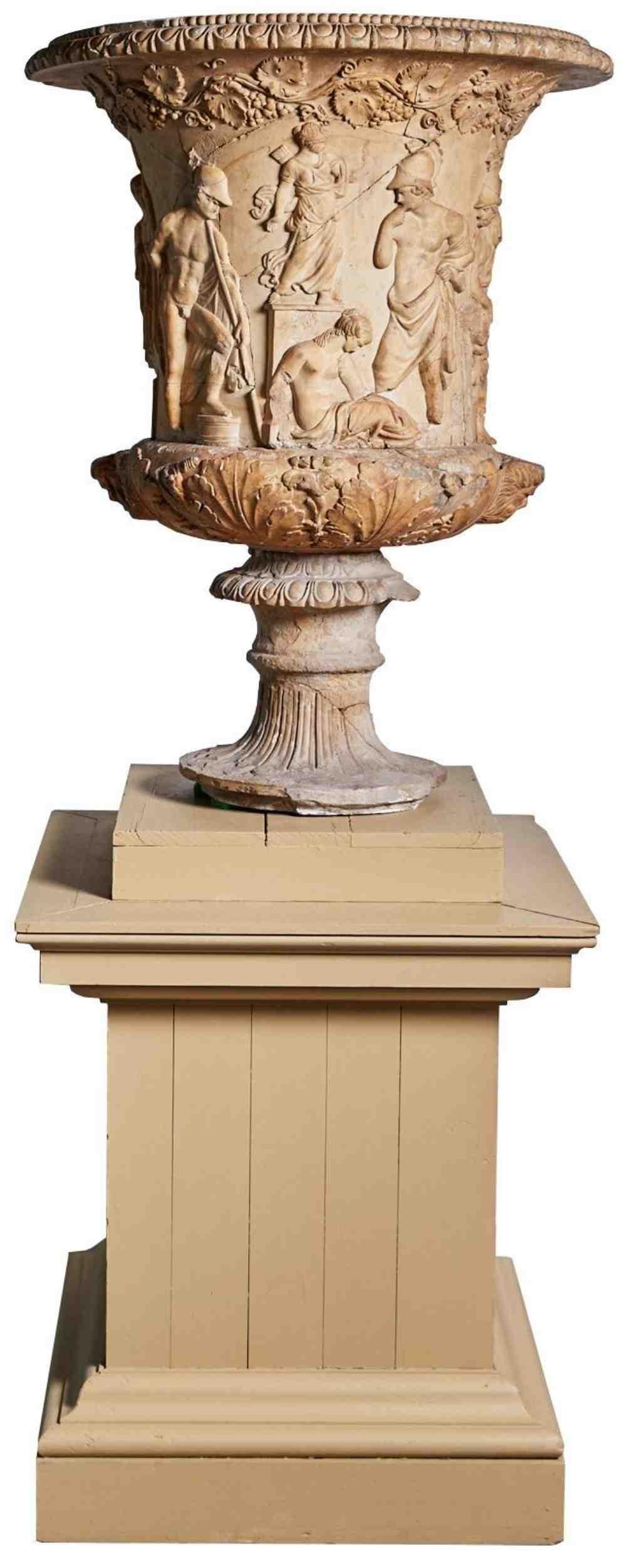 Coade Stone Medici urn. A large Coade stone urn after the The Medici Vase. The Urn comes with a custom timber pedestal.
Attached is an image taken from Mrs Coades Stone by Allison Kelly. The photograph shows a similar Coade design to the Medici