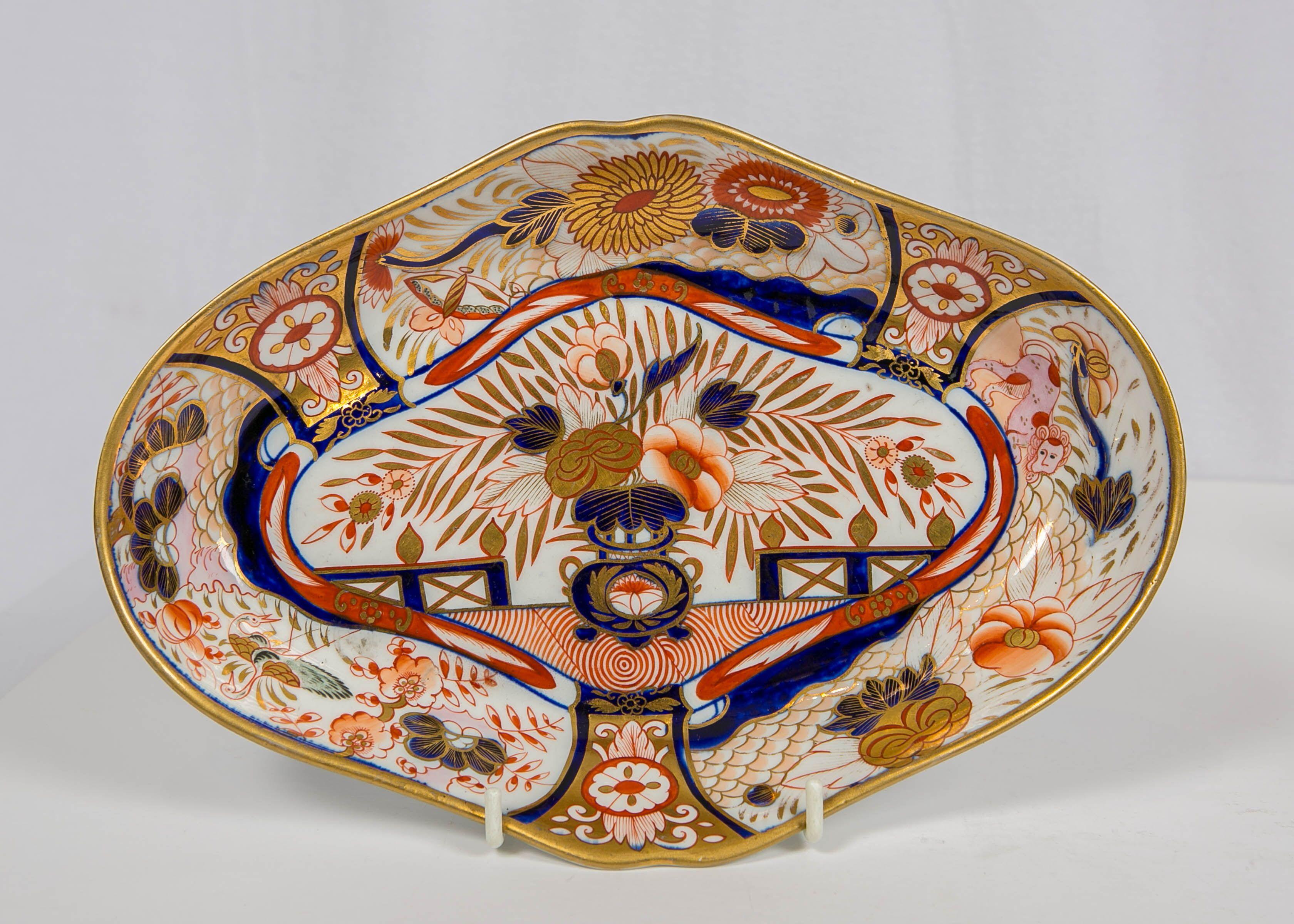 Why we love it: The intensity of the Imari colors and the wonderful pink spotted lion. 
This group of three Coalport Admiral Nelson oval dishes was hand-painted in England during the Regency period circa 1810. They are decorated in a traditional,