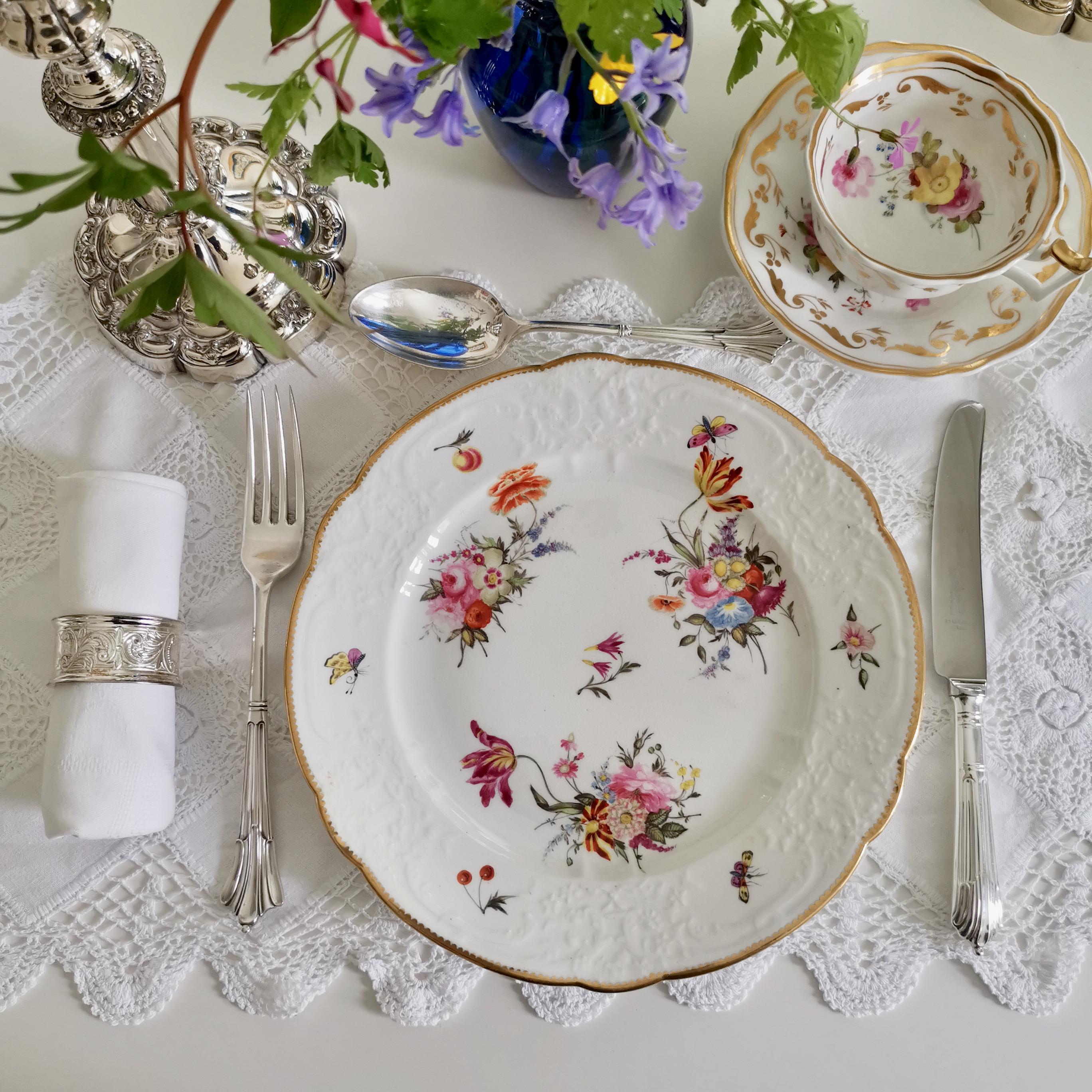 This is a beautiful dessert plate made by Coalport some time between 1815 and 1825. The plate is white blind-moulded and decorated with beautiful hand painted flowers and butterflies.

Coalport was one of the leading potters in 19th and 20th