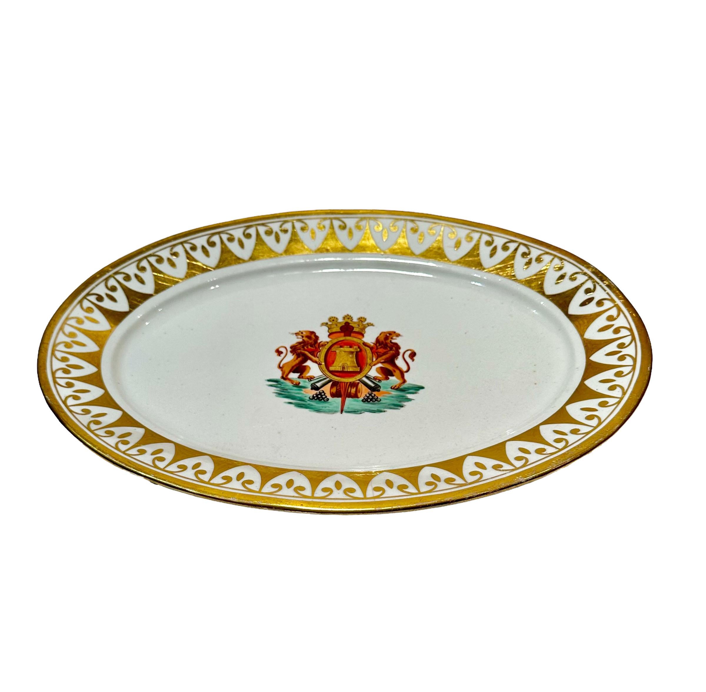Large Coalport platter with coat of arms center and a fabulous border of gold gilt. Circa 1850s to 1890s, England.